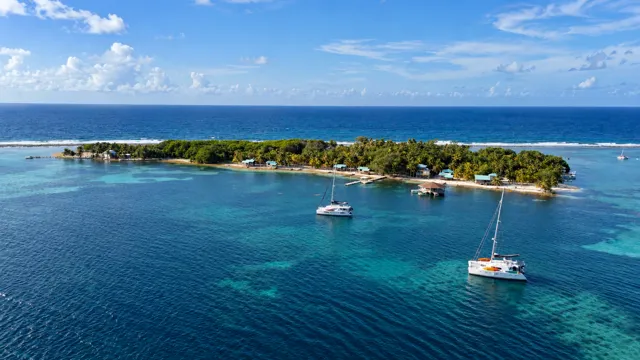 Wide aerial view of the island and surrounding lagoon