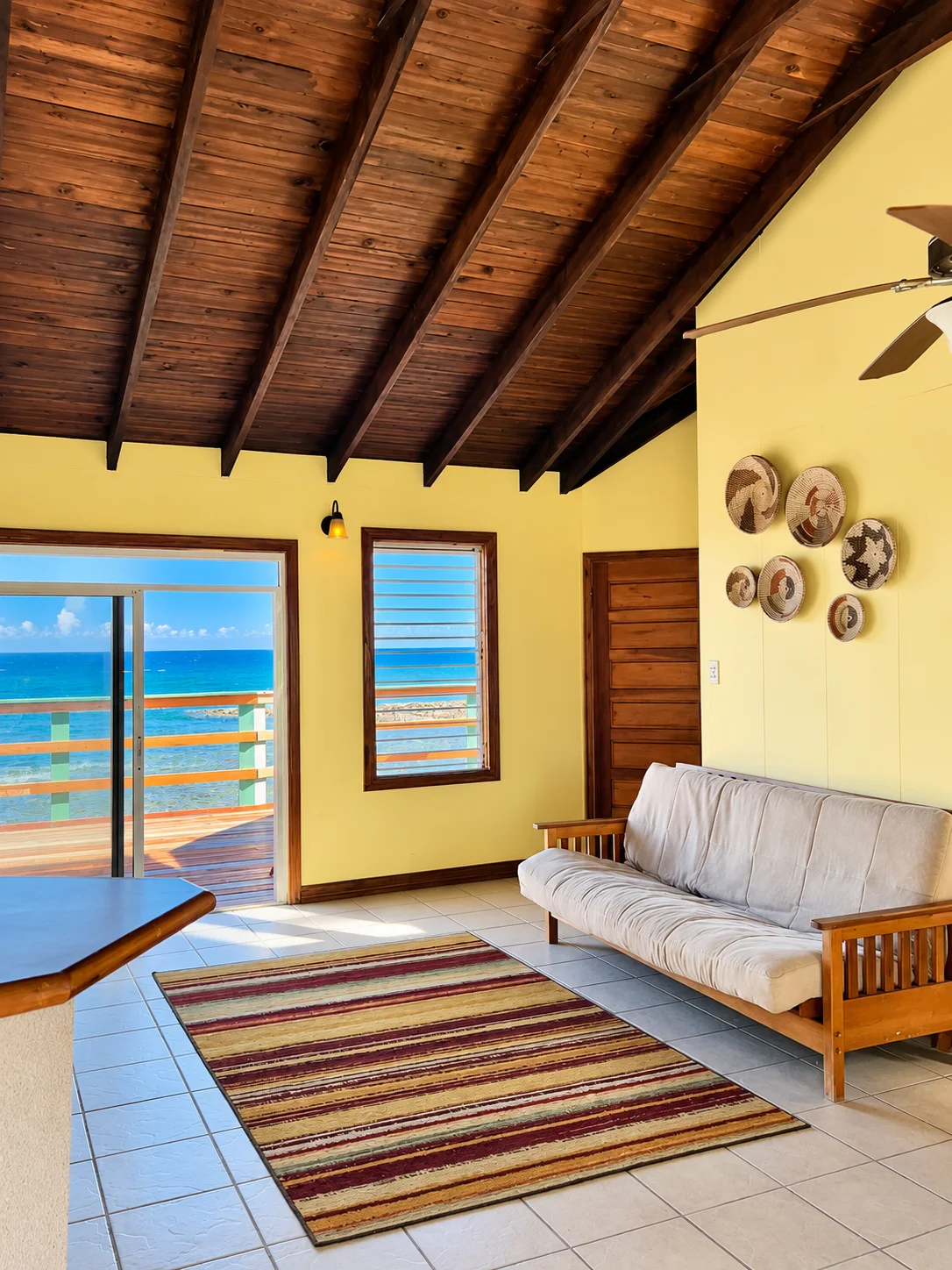 Reef House lounge with sea-facing doors